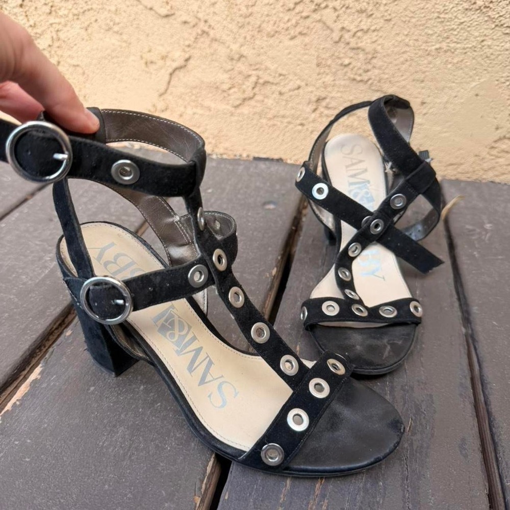 Black heels with silver eyelets